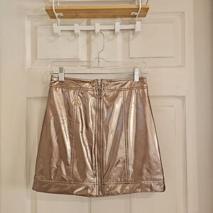 New Forever 21 skirt in perfect condition; if Forever 21 Shiny Bronze Mini Skirt